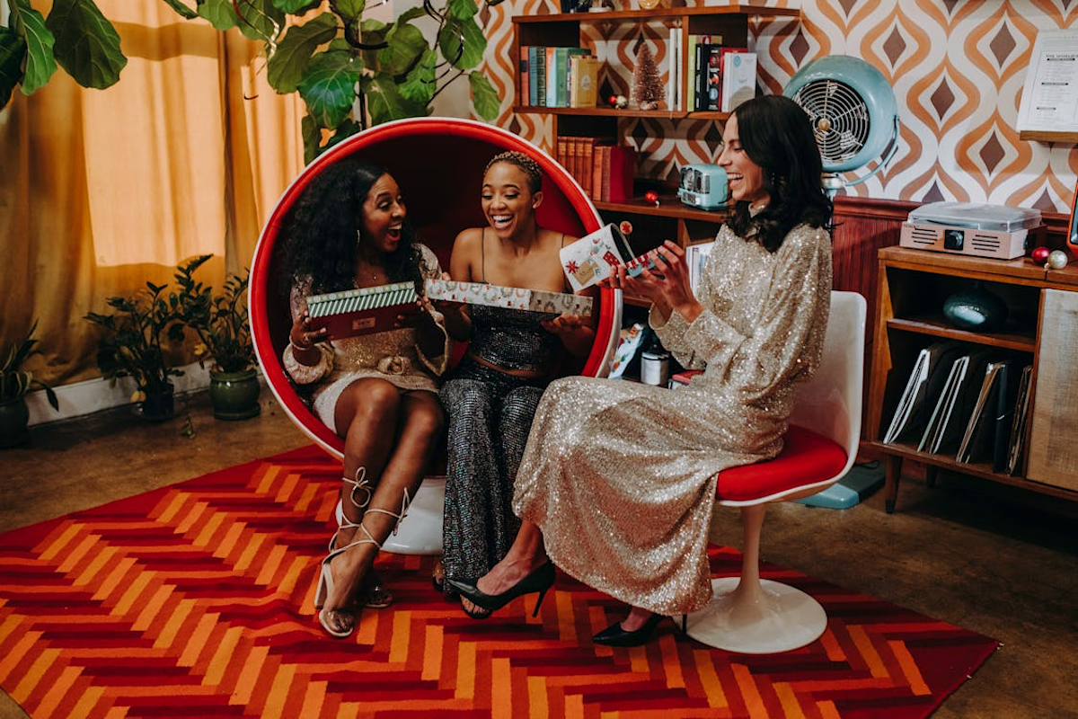 Women Opening Gifts Together