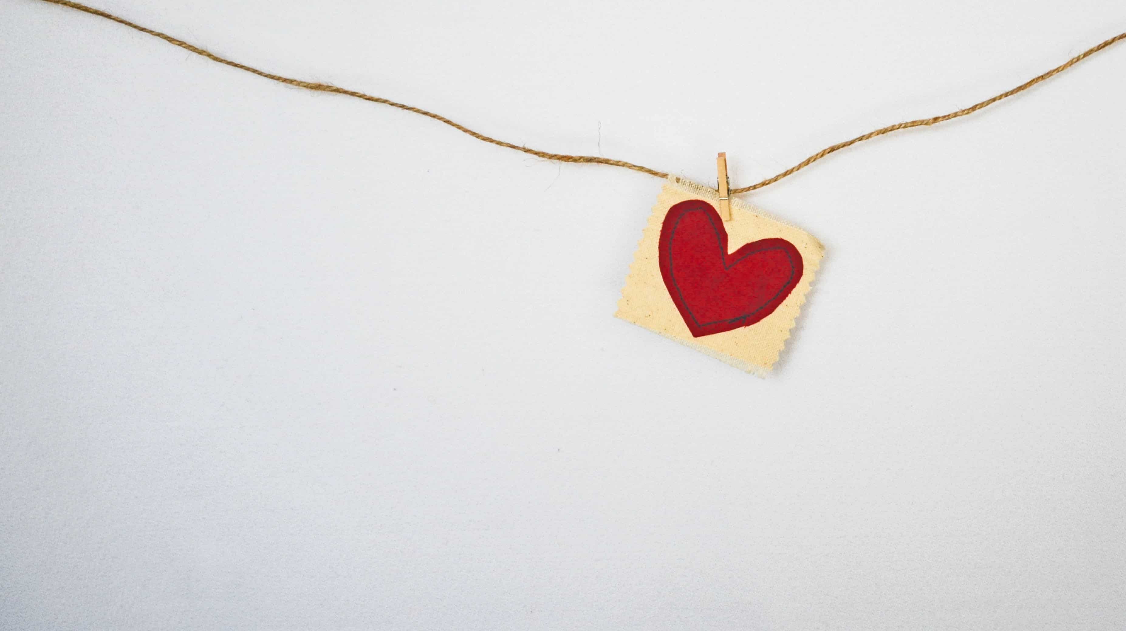 Fabric heart symbol pegged on string
