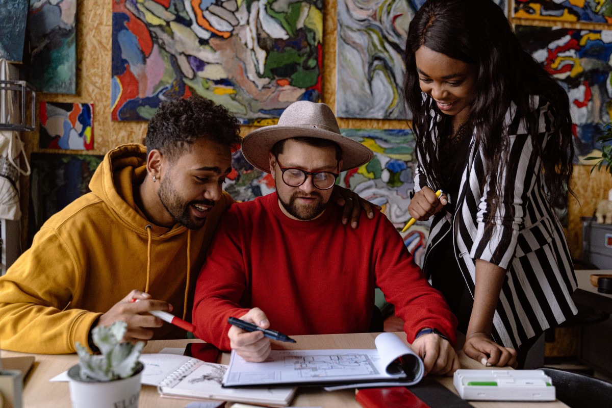 Three people working on a project