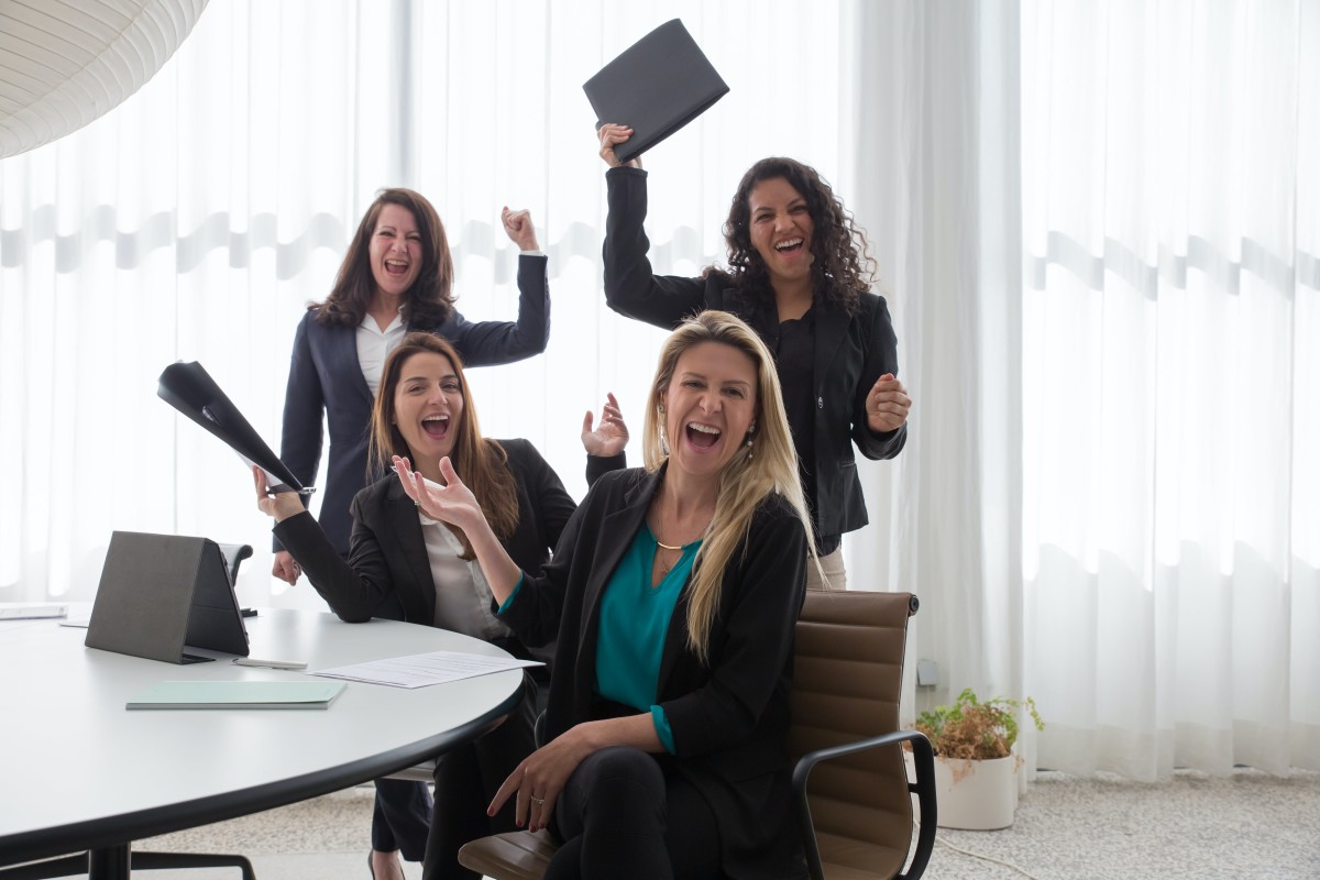 Happy businesswomen in a conference room