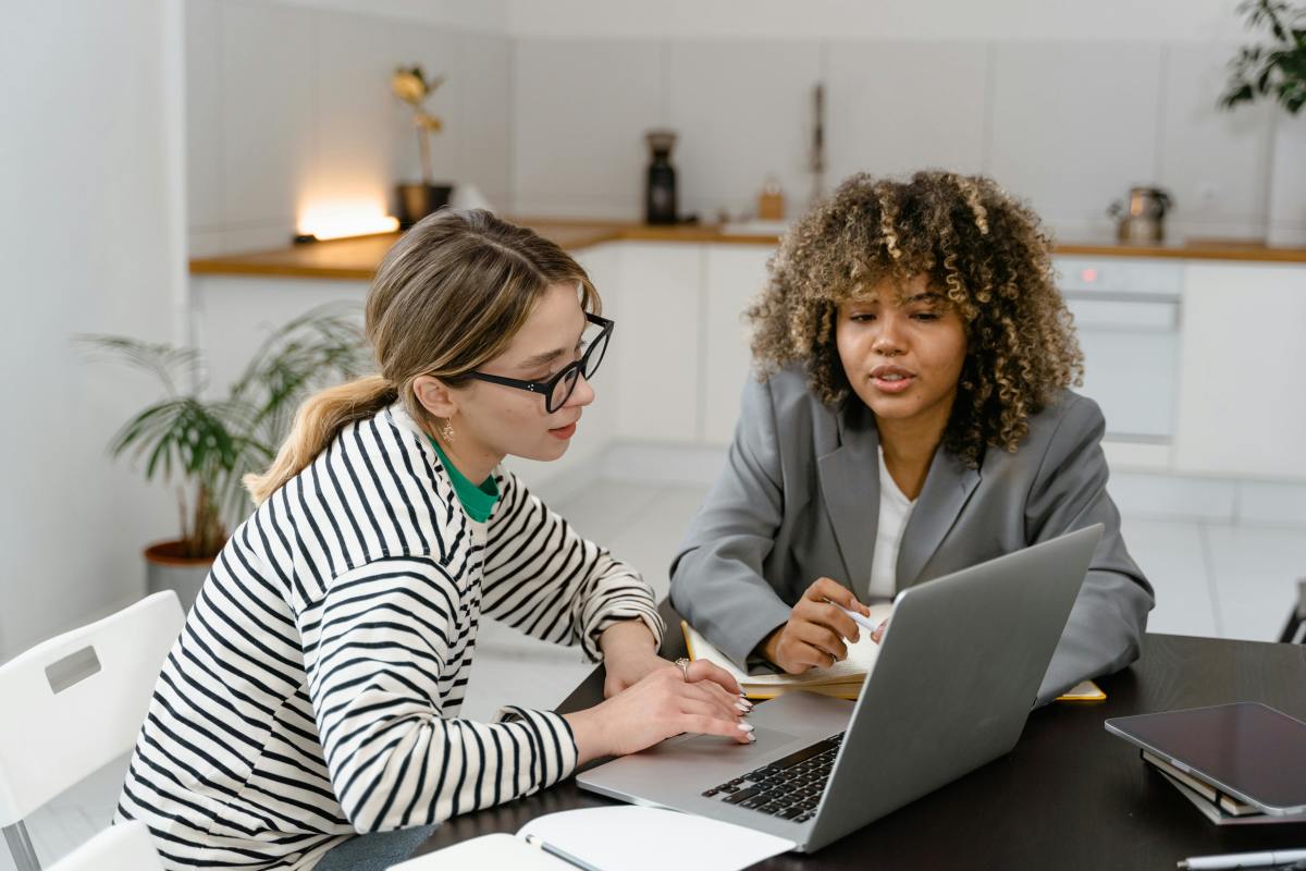 Women working together on a laptop