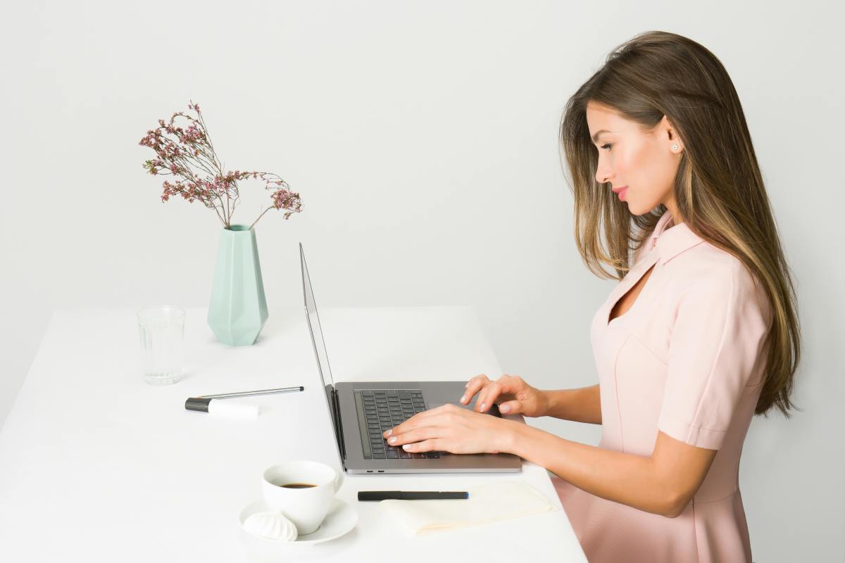 Woman typing on a laptop