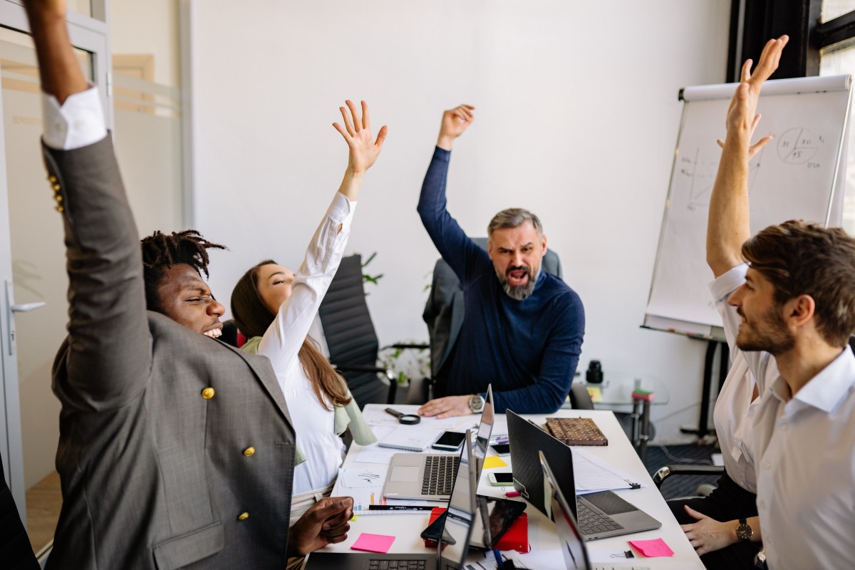 Team celebrating in an office