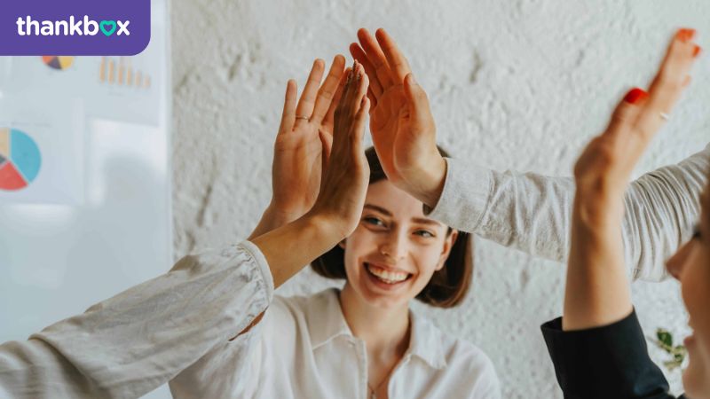 High fives for recognition in the office