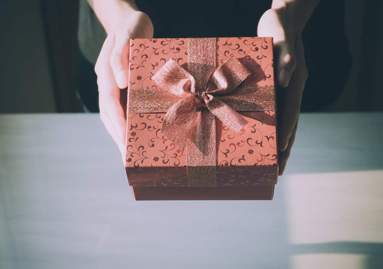 Image of a peach covered wedding gift box with ribbon